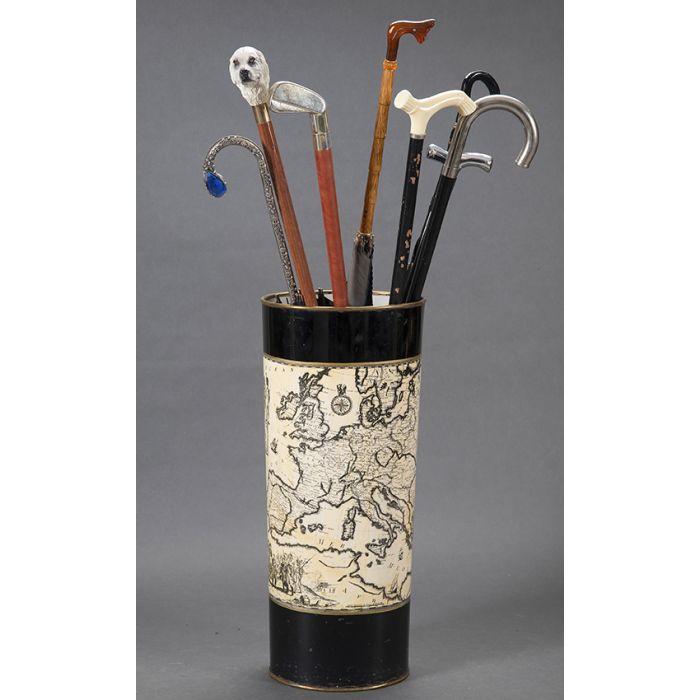 1063-Conjunto de 4 bastones y tres paraguas. s. XX. su paraguero en metal esmaltado. | Durán