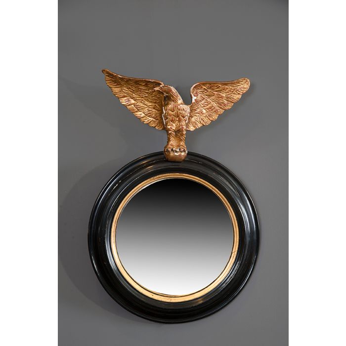 738-Espejo ojo de buey con marco de madera ebonizada con filos dorados y  copete con águila Imperial en dorado. Diámetro: 70 cm. | Fernando Durán