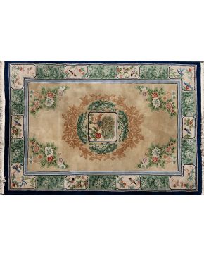 873-Lote formado por dos alfombras chinas. una sobre campo rosa y otra sobre campo verde agua. Decoración floral y de aves. 