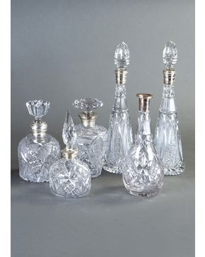 460-Lote de seis licoreras en cristal tallado con embocaduras de plata. dos de ellas pareja.