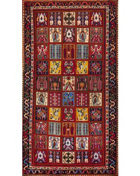 1303-Lote de dos alfombras persas en lana. una BAHTIARI y otra BALUCHI. En lana sobre campos granates. Una con decoración de cuarterones y otra con motivos