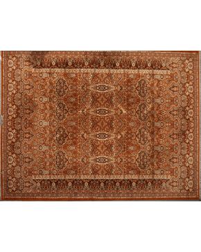 1113-Pareja de alfombras en lana con profusa decoración vegetal y floral sobre campo marrón. Diferentes tamaños.