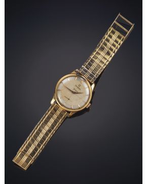 1066-OMEGA Geneve Años 50. Reloj de pulsera para caballero con caja y brazalete en oro amarillo de 18 k. Movimiento de cuerda manual. Numeración a trazos