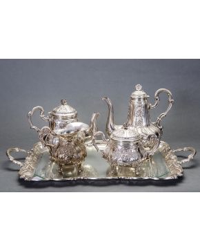 926-Juego de café y té estilo Luis XV en plata española punzonada formado por: cafetera. tetera. azucarero y lechera con decoración cinceladas de motivos 