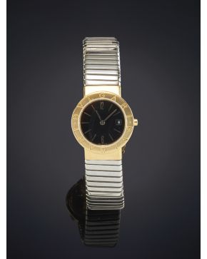 921-BVLGARI Reloj de pulsera para señora con caja y brazalete tubo gas de acero y oro 18k. Movimiento de cuarzo. Esfera negra con numeración a trazos ap