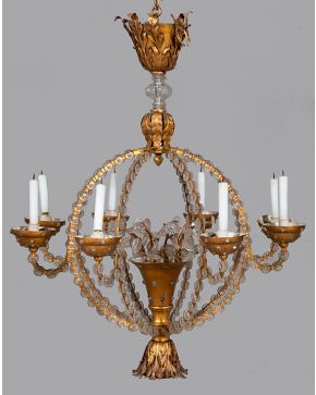533-Lámpara de techo de 8 luces en bronce y cristal con original estructura esférica. Flores y hojas aplicadas.