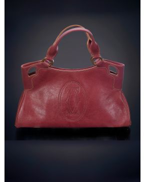 751-CARTIER MODELO MARCELO. Bolso e mano en cuero burdeos con el logo en el centro martillado.