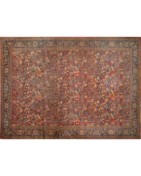780-Gran alfombra persa de lana con profusa decoración floral y vegetal sobre campo color teja. 