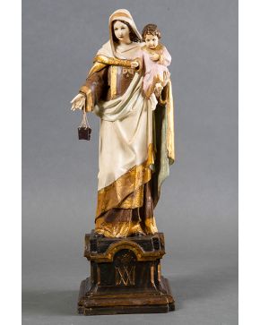 466-ESCUELA ESPAÑOLA S.XIX Virgen del Carmen  Escultura en marfil y madera tallada y policromada. Medidas: 54x19x18 cm  