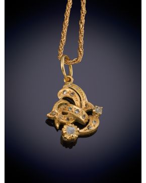 54-ELEGANTE COLGANTE CON BRILLANTES Y CADENA en oro amarillo de 18K.