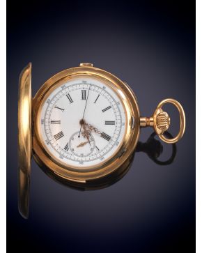 844-Reloj saboneta francés de complicación con sonería a minutos y cronógrafo, maquinaria vista. caja en oro amarillo de