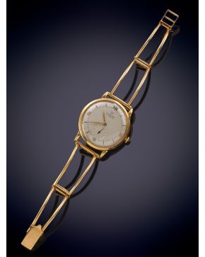 1090-OMEGA. RELOJ DE PULSERA AÑOS 70. CAJA Y BRAZALETE ESQUELETO EN ORO AMARILLO DE 18K. MOVIMIENTO AUTOMÁTICO. ESFERA GRI
