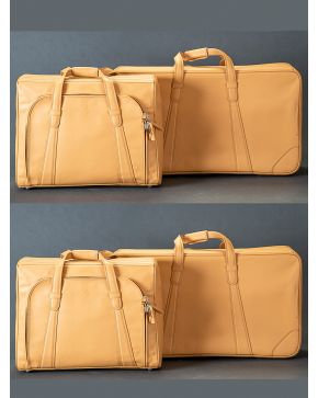 983-FERRARI" Conjunto de cuatro maletas en piel marrón."
