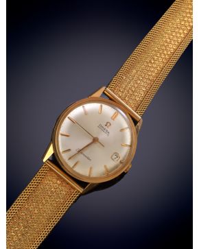 711-OMEGA"" RELOJ DE PULSERA CON CAJA Y BRAZALETE EN ORO AMARILLO DE 18K. MOVIMIENTO AUTOMÁTICO. Esfera gris con numeración a trazo