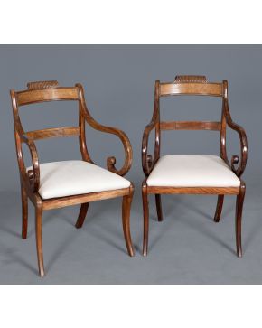 355-Pareja de butacas o fauteuils" de chasis estilo Restauración, con madera de raíz en travesaño superior del respaldo,