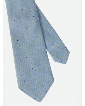 879-HERMÉS. CORBATA EN COLOR AZUL CLARITO CON DETALLE DE MOTAS DE COLORES.
